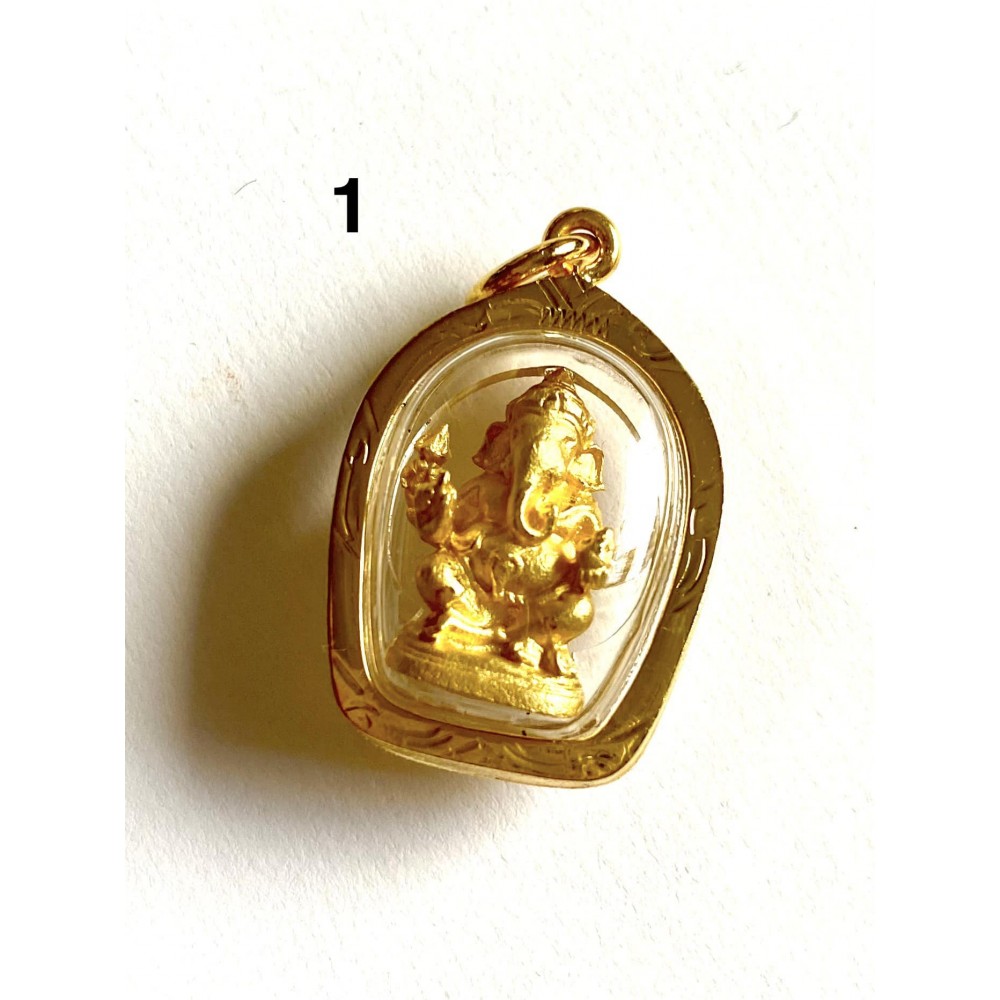 Small Buddha pendants. Goldfilled. Chain attached to the side