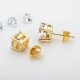 Quality stud earrings with zirkonia in steel/gold, different sizes.